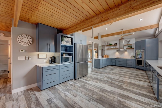 kitchen featuring appliances with stainless steel finishes, backsplash, wood ceiling, wall chimney range hood, and beam ceiling