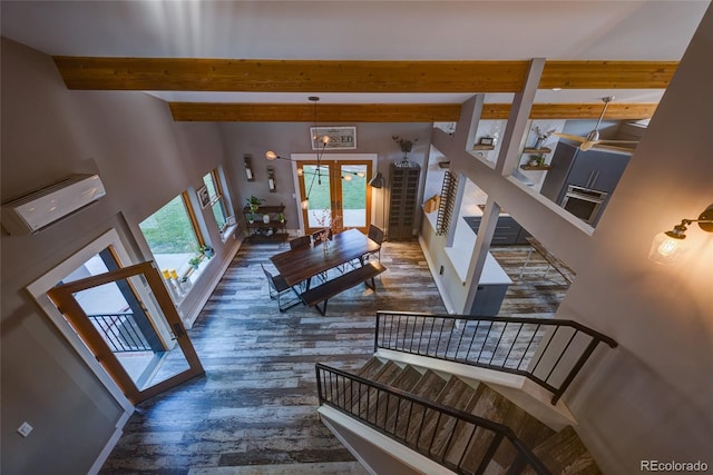 stairway featuring hardwood / wood-style floors, french doors, and beamed ceiling