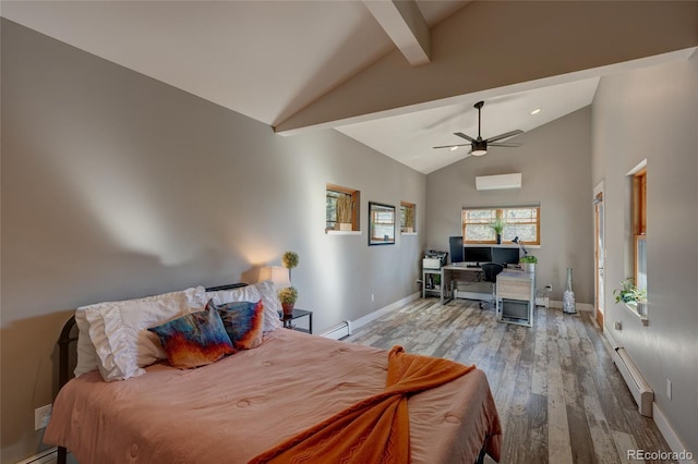 bedroom featuring a wall unit AC, beamed ceiling, ceiling fan, light hardwood / wood-style floors, and a baseboard heating unit