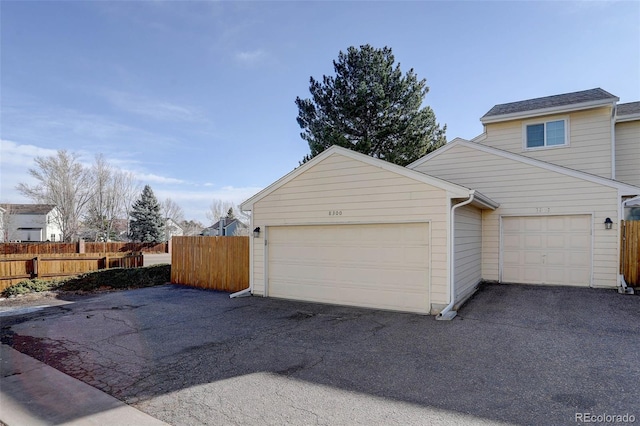 garage with fence