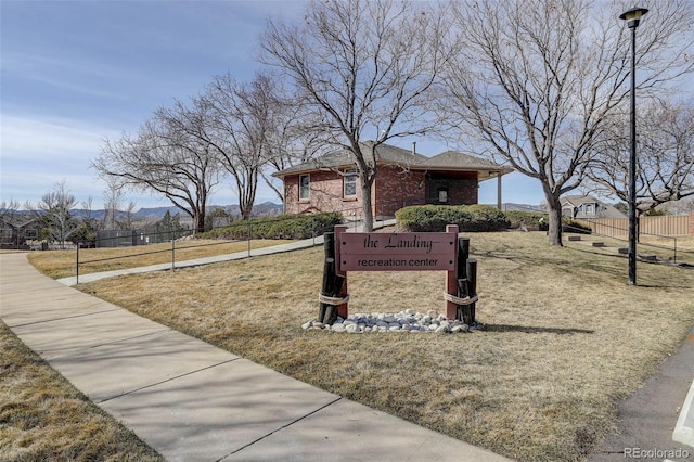 view of property's community featuring a mountain view and fence