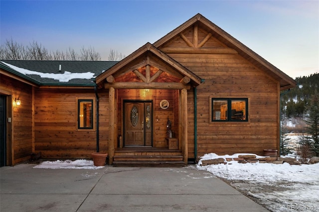 view of front of house featuring a shingled roof