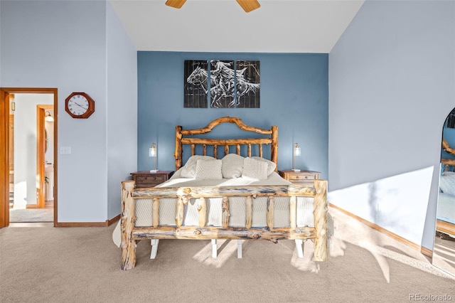 carpeted bedroom with ceiling fan and baseboards