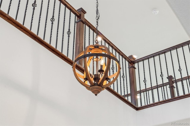 staircase featuring a notable chandelier