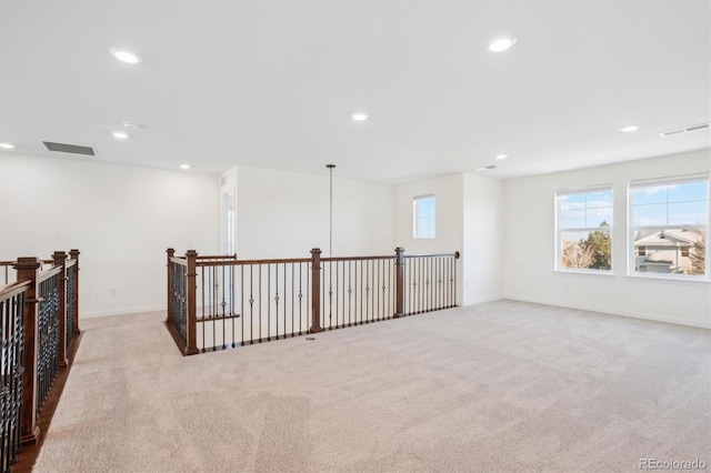 unfurnished room featuring recessed lighting, visible vents, and carpet floors