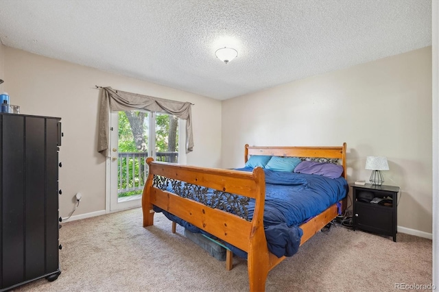 848 S 13th Ave, Brighton, CO 80601 - carpeted bedroom with a textured ceiling, access to outside, and baseboards
