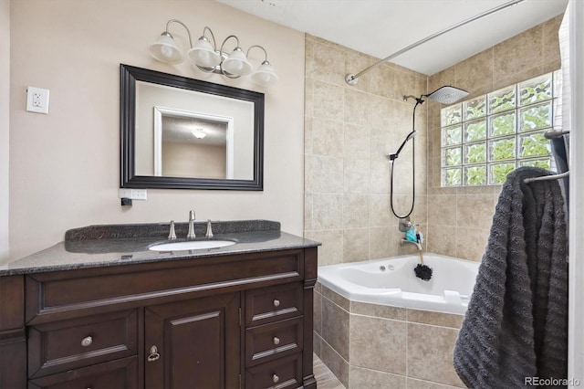 848 S 13th Ave, Brighton, CO 80601 - bathroom featuring tiled shower / bath combo and vanity