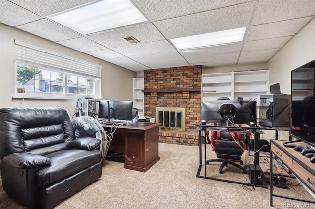 848 S 13th Ave, Brighton, CO 80601 - office area featuring a paneled ceiling, carpet floors, and a brick fireplace