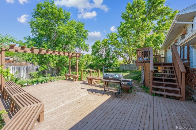 848 S 13th Ave, Brighton, CO 80601 - deck with a fenced backyard, stairs, and a grill