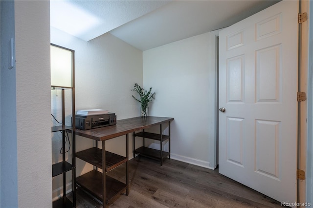 office featuring baseboards and wood finished floors