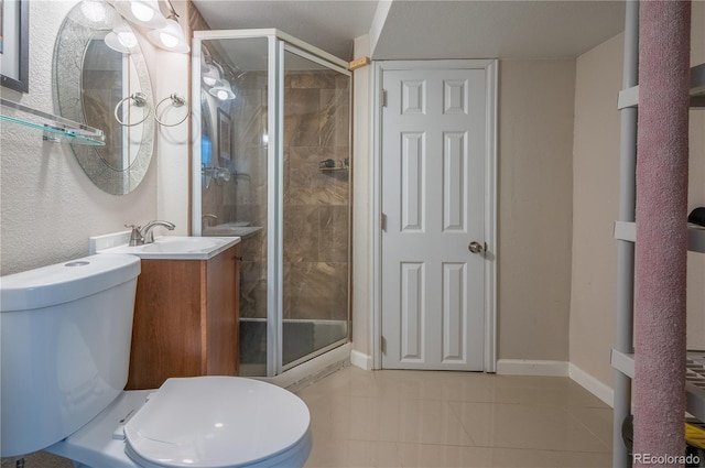 full bath with tile patterned flooring, toilet, vanity, baseboards, and a stall shower