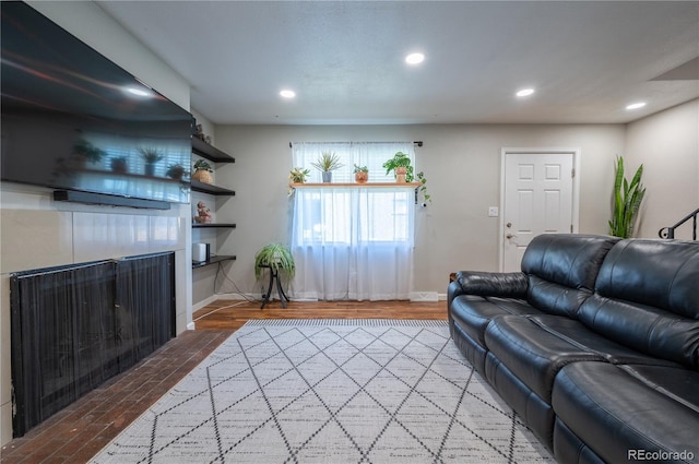 4673 S Lowell Blvd, Denver, CO 80236 - living room featuring baseboards, a fireplace, recessed lighting, and wood finished floors