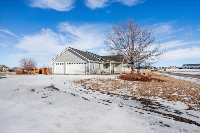 51 W 6th Pl, Byers, CO 80103 - view of front of house with a garage and covered porch