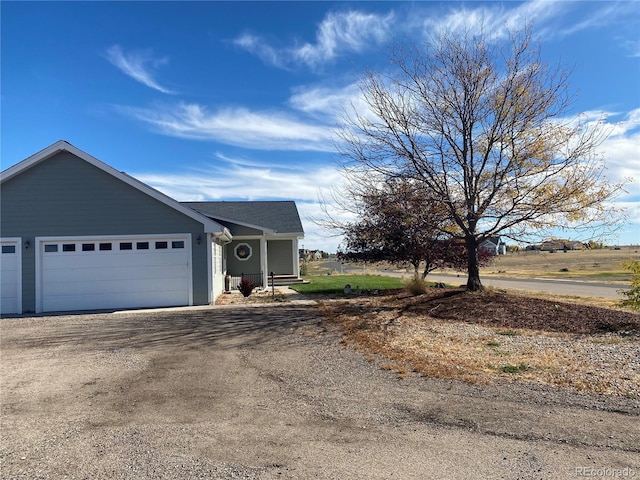 51 W 6th Pl, Byers, CO 80103 - view of front of home with an attached garage and driveway
