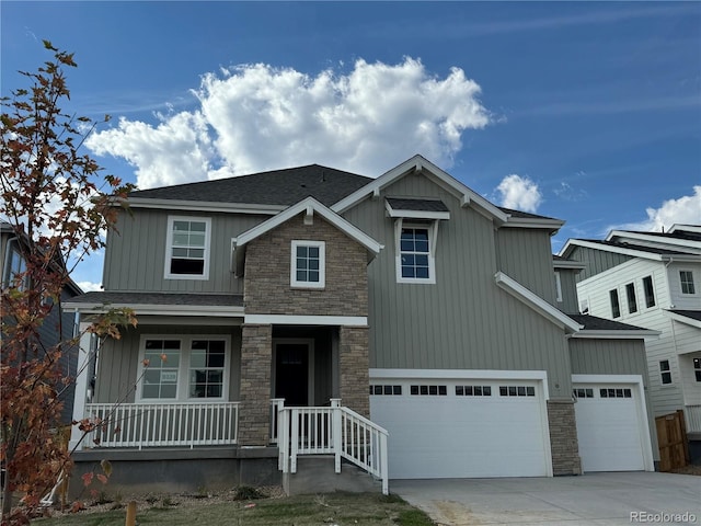 craftsman-style home with covered porch and a garage