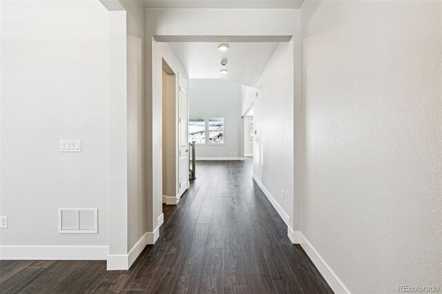 hall featuring dark wood-type flooring