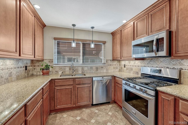 kitchen featuring a sink, brown cabinets, backsplash, and stainless steel appliances