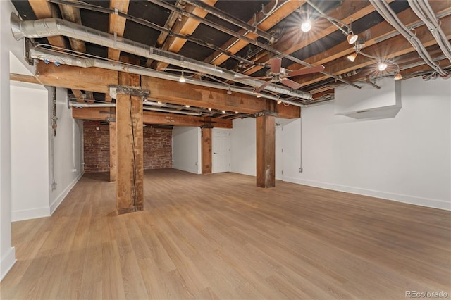 basement featuring hardwood / wood-style floors