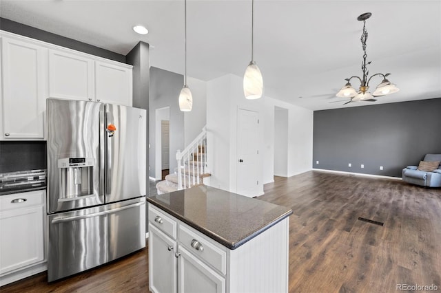 4807 S Killarney Ct, Aurora, CO 80015 - kitchen featuring stainless steel fridge, a chandelier, open floor plan, dark wood-style floors, and white cabinets