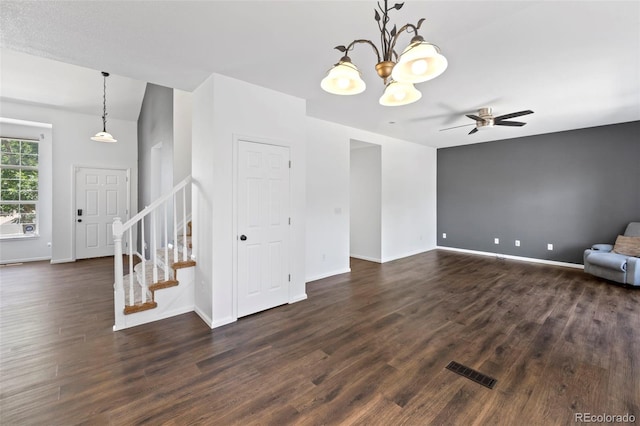 4807 S Killarney Ct, Aurora, CO 80015 - unfurnished living room with dark wood finished floors, stairway, ceiling fan, and a chandelier
