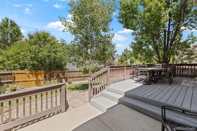 4807 S Killarney Ct, Aurora, CO 80015 - wooden terrace with outdoor dining area and a fenced backyard
