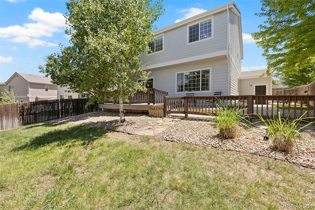 4807 S Killarney Ct, Aurora, CO 80015 - rear view of house featuring a fenced backyard and a deck