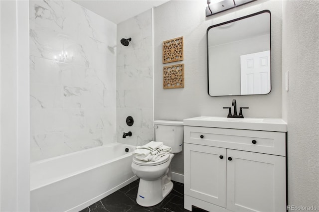 full bath featuring marble look tile flooring, toilet, vanity, and shower / washtub combination