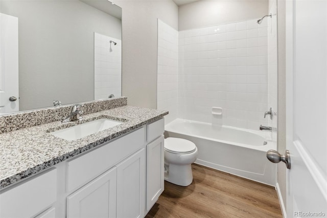 full bathroom with vanity, toilet, wood-type flooring, and bathing tub / shower combination