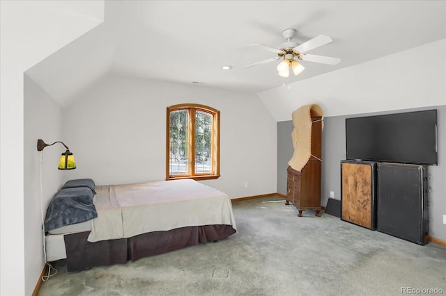 bedroom featuring ceiling fan, light colored carpet, and lofted ceiling