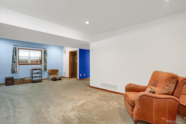 living area with carpet flooring