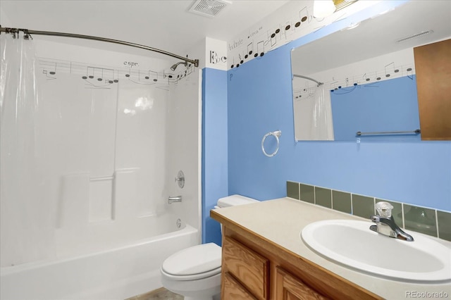 full bathroom with shower / bath combination with curtain, toilet, and vanity