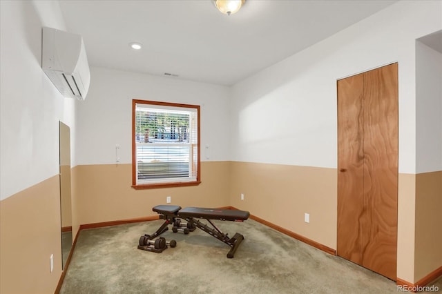 empty room featuring carpet flooring and a wall mounted AC