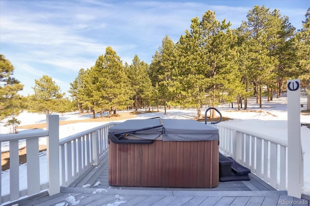 wooden deck featuring a hot tub