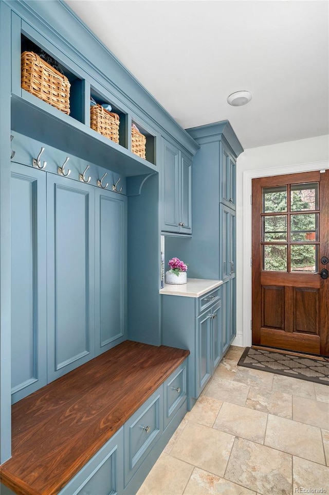 mudroom with stone finish floor