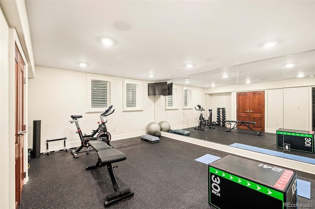 exercise room featuring recessed lighting and baseboards