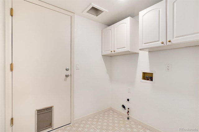 clothes washing area with electric dryer hookup, gas dryer hookup, hookup for a washing machine, and cabinets