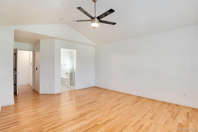 spare room with ceiling fan, light hardwood / wood-style floors, and vaulted ceiling