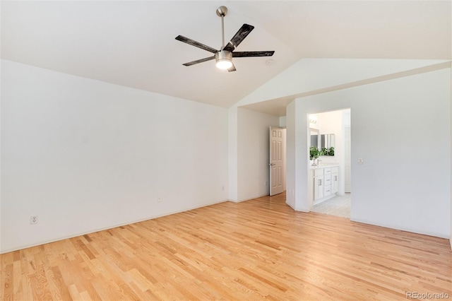 unfurnished room featuring ceiling fan, vaulted ceiling, and light hardwood / wood-style flooring