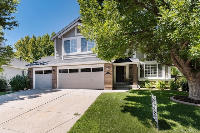 view of front of house with a garage and a front yard