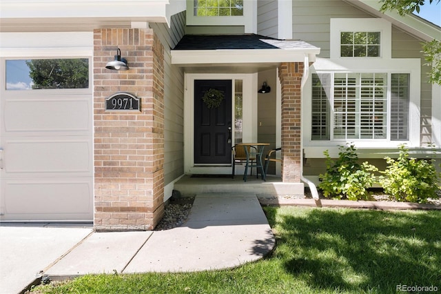 view of exterior entry with covered porch