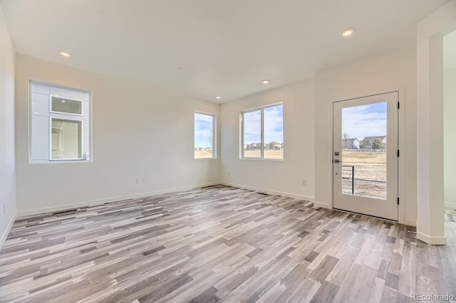 empty room with light wood-type flooring