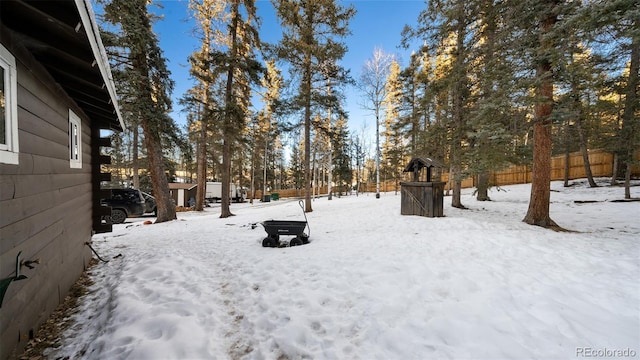 view of yard covered in snow