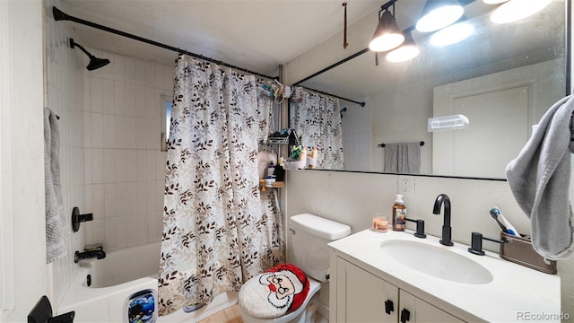 full bathroom featuring vanity, toilet, and shower / bath combo with shower curtain