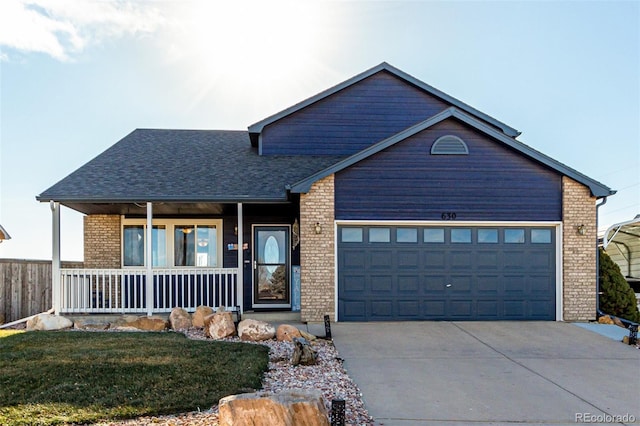 view of front of home with covered porch and a garage