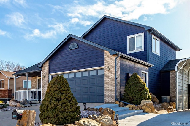 view of front of property featuring a porch and a garage