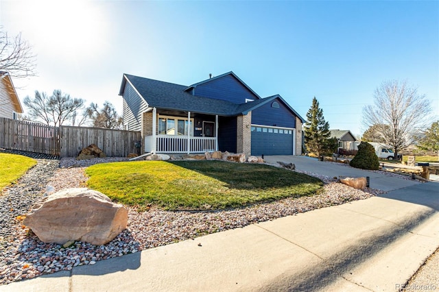 view of front facade with a porch, a front yard, and a garage