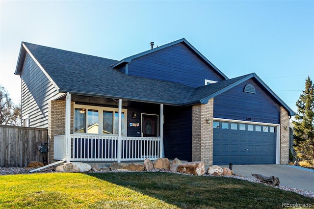 view of front of property featuring a front lawn, a porch, and a garage