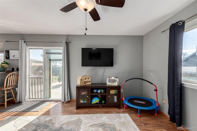 interior space featuring hardwood / wood-style flooring and ceiling fan