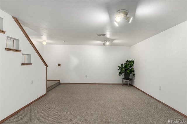 unfurnished room featuring carpet flooring