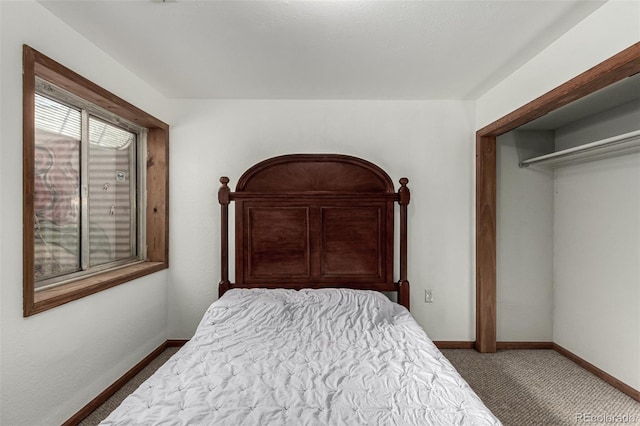 carpeted bedroom featuring a closet